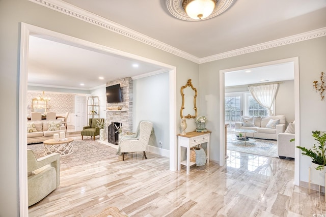 living area featuring crown molding and a fireplace