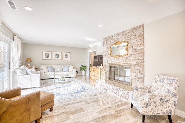 living room featuring a fireplace