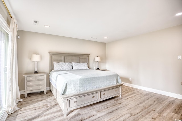 bedroom with light hardwood / wood-style flooring