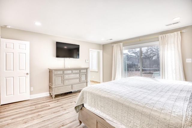 bedroom with light hardwood / wood-style floors