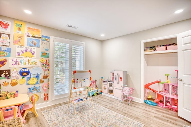 recreation room featuring hardwood / wood-style floors