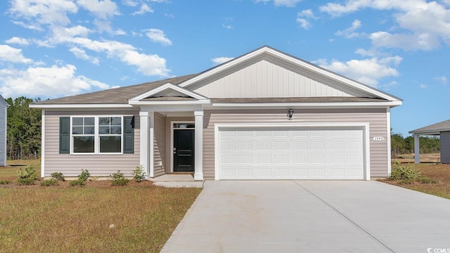 view of front facade featuring a garage and a front yard