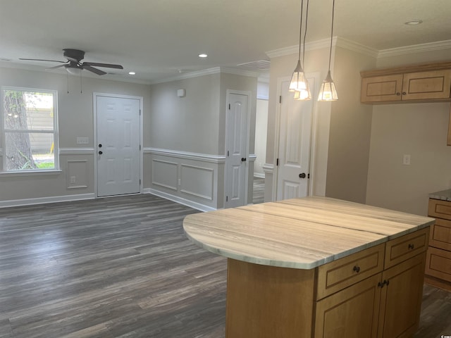 kitchen with crown molding, decorative light fixtures, dark hardwood / wood-style floors, and a center island