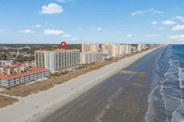 bird's eye view featuring a view of the beach and a water view