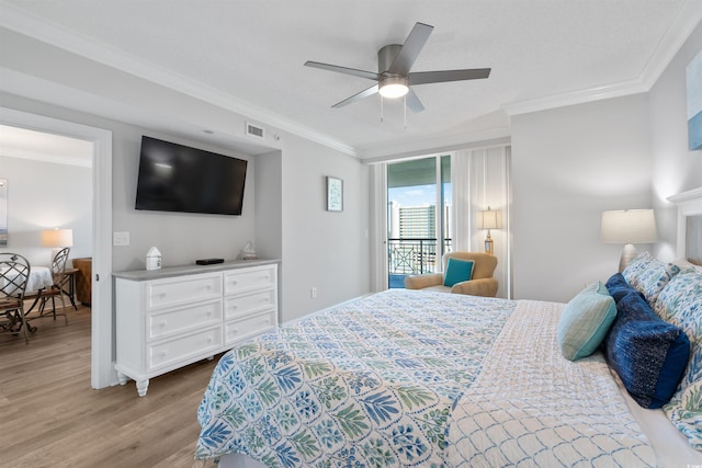 bedroom featuring crown molding, ceiling fan, and light wood-type flooring