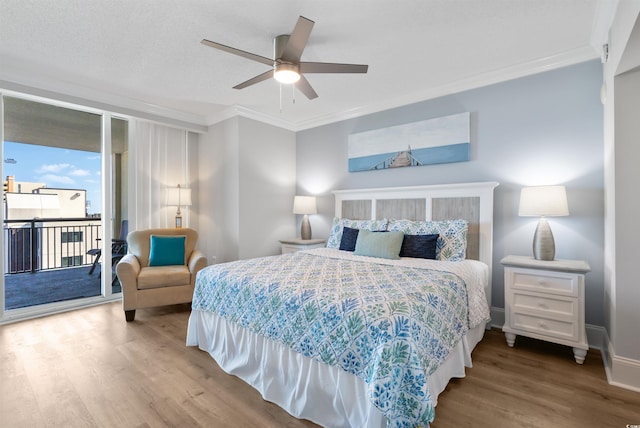 bedroom with hardwood / wood-style flooring, ceiling fan, ornamental molding, and access to exterior