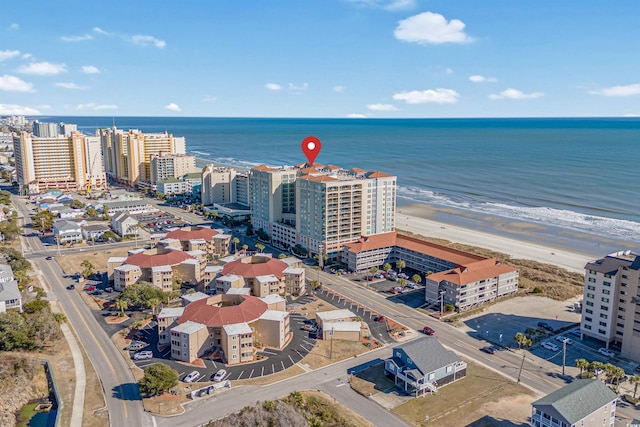 bird's eye view featuring a water view and a view of the beach