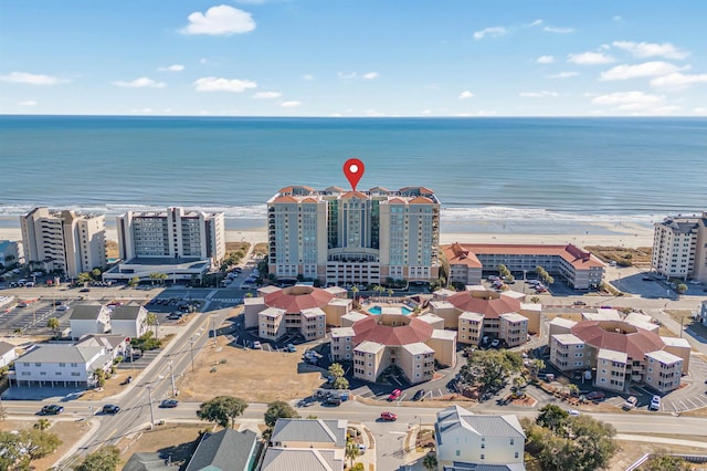 aerial view with a water view and a view of the beach