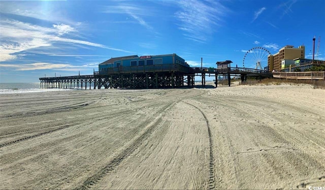 exterior space featuring a view of the beach and a water view