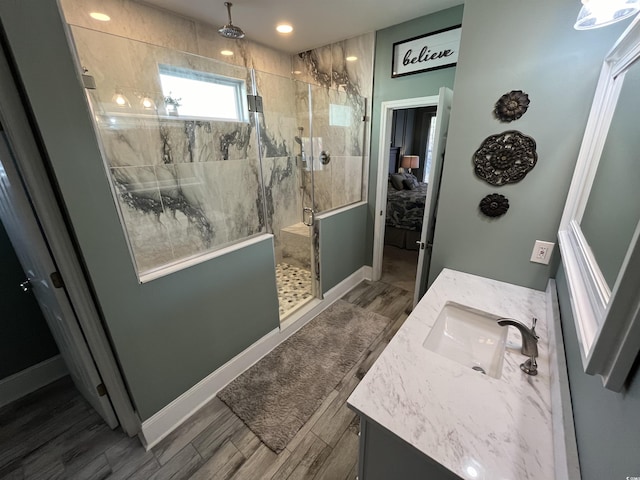 bathroom with vanity and a shower with shower door