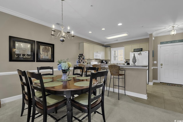 tiled dining room featuring crown molding