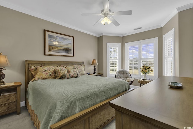 bedroom featuring crown molding, ceiling fan, and light carpet