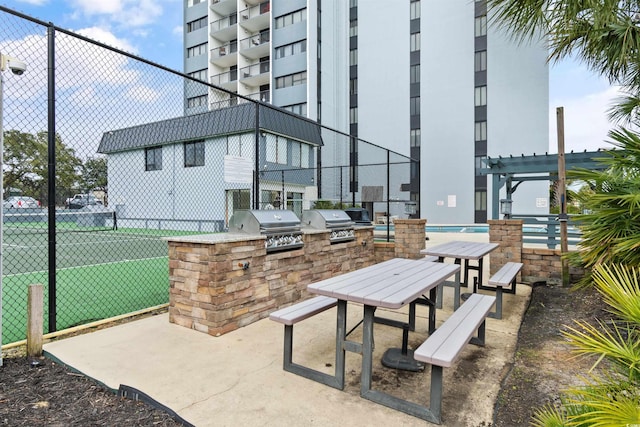 view of home's community featuring area for grilling and a pergola