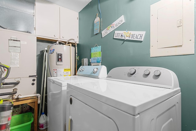 laundry area with water heater, washing machine and clothes dryer, cabinets, and electric panel