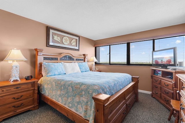 carpeted bedroom with a textured ceiling