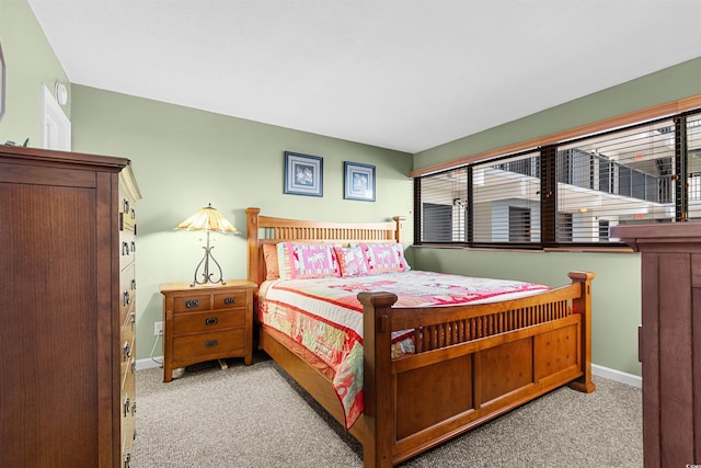 bedroom featuring light colored carpet