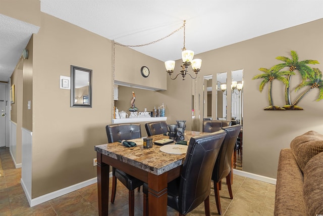 dining space featuring a notable chandelier