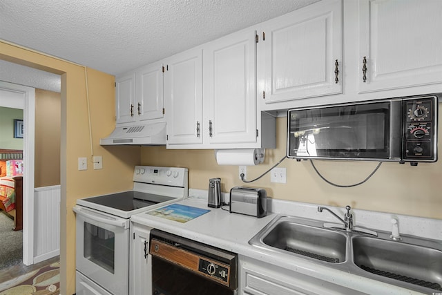 kitchen featuring sink, a textured ceiling, black appliances, and white cabinets