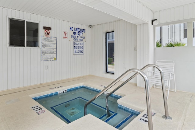 view of pool featuring an indoor hot tub