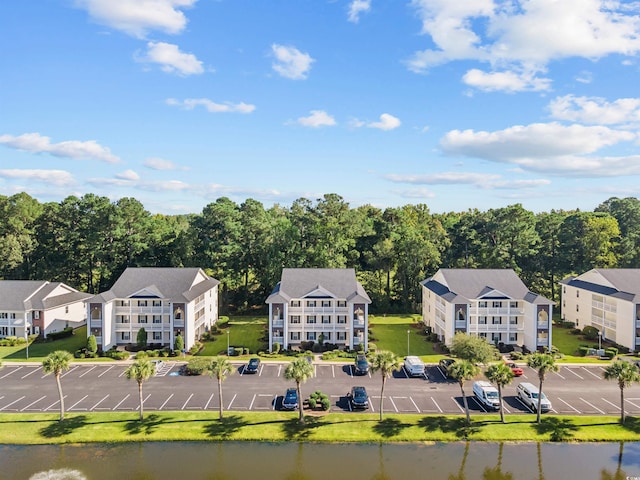 birds eye view of property with a water view