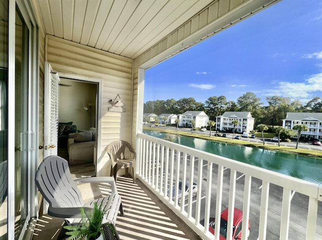 balcony featuring a water view