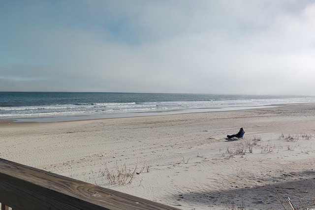 property view of water featuring a beach view