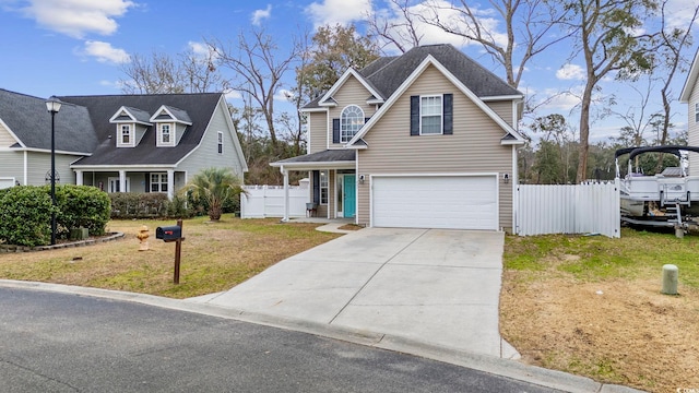 view of front of property featuring a garage and a front yard