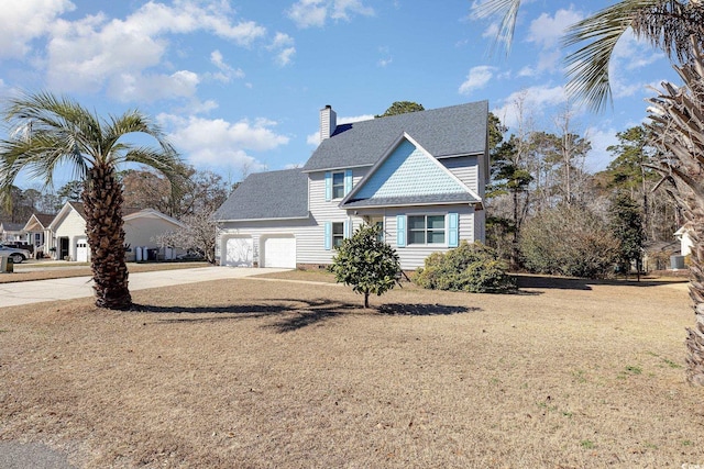 view of front of house featuring a garage and a front yard