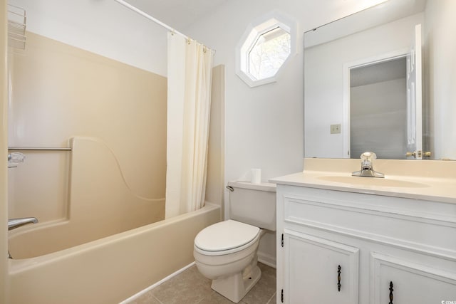 full bathroom featuring vanity, tile patterned floors, toilet, and shower / bath combo with shower curtain