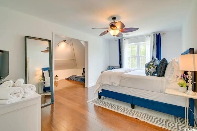 bedroom featuring a ceiling fan and wood finished floors