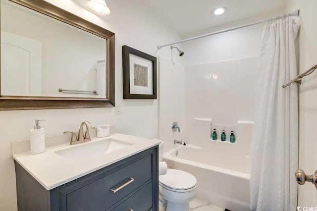 bathroom with toilet, shower / bathtub combination with curtain, and vanity