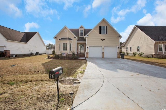 traditional-style home with central air condition unit, an attached garage, brick siding, concrete driveway, and a front yard
