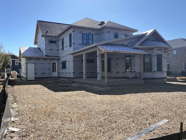 property under construction featuring a patio