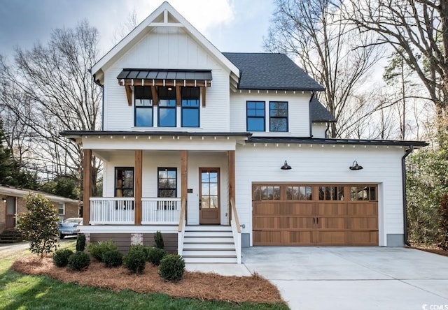 modern farmhouse style home featuring a porch and a garage