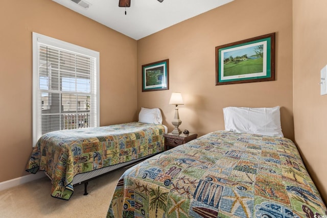 bedroom featuring ceiling fan and carpet