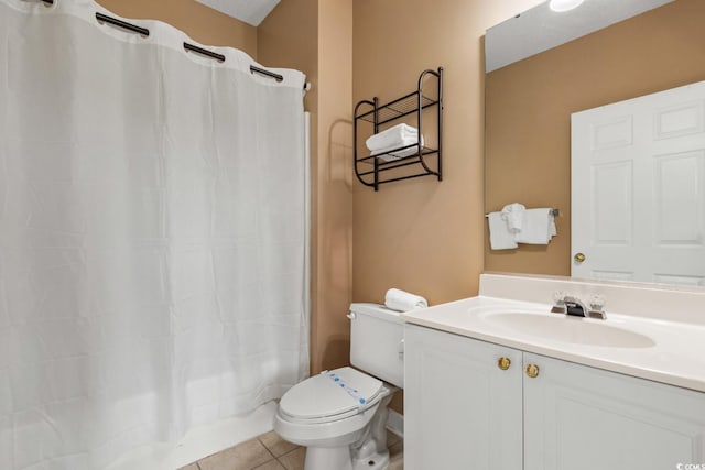 full bathroom featuring tile patterned flooring, vanity, toilet, and shower / bath combo