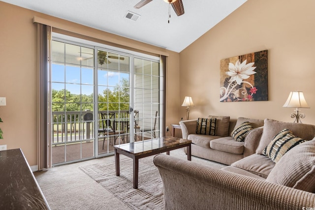 living room featuring carpet, lofted ceiling, and ceiling fan