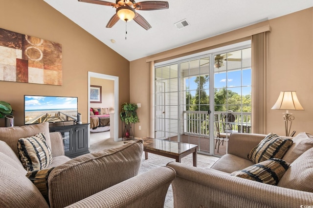 carpeted living room featuring vaulted ceiling and ceiling fan