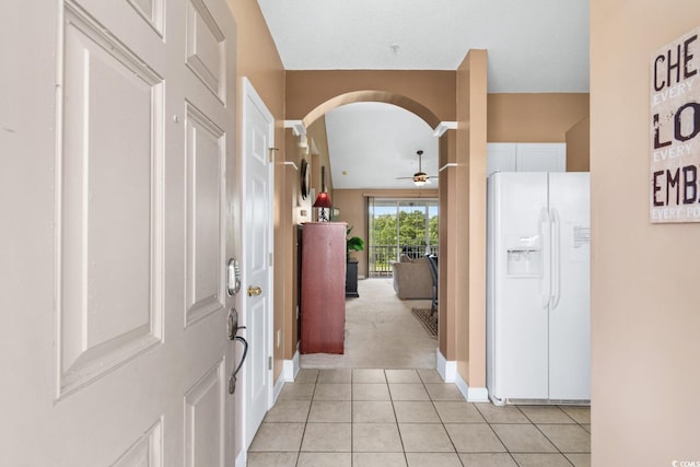 hall with light tile patterned floors