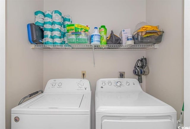 laundry area featuring washing machine and clothes dryer