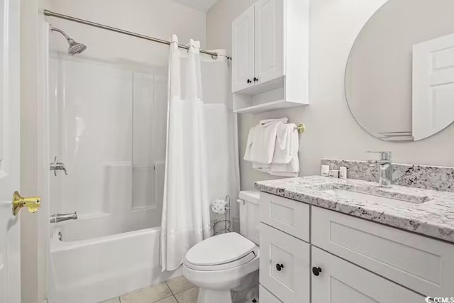 full bathroom with shower / bathtub combination with curtain, vanity, tile patterned flooring, and toilet