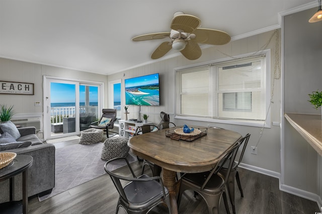 dining area featuring crown molding, ceiling fan, and dark hardwood / wood-style flooring