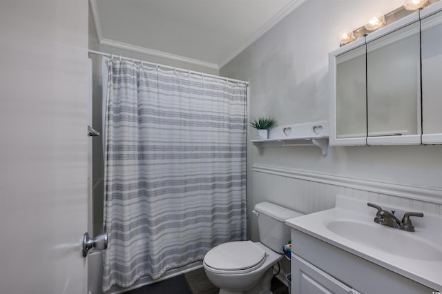 bathroom with crown molding, vanity, toilet, and a shower with shower curtain