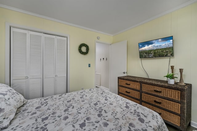 bedroom with crown molding and a closet