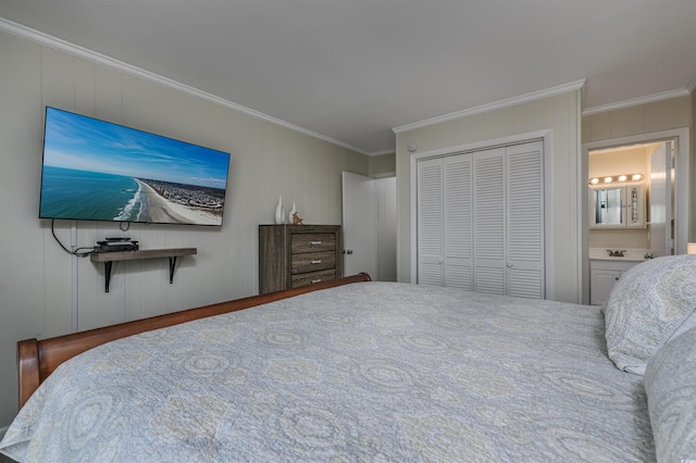 bedroom featuring ornamental molding, connected bathroom, and a closet