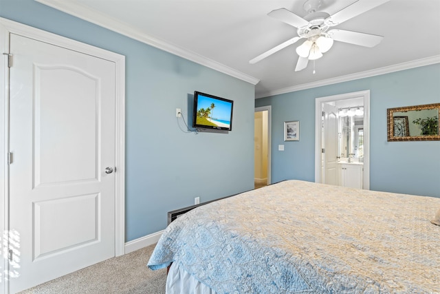 bedroom with ceiling fan, ornamental molding, connected bathroom, and carpet floors