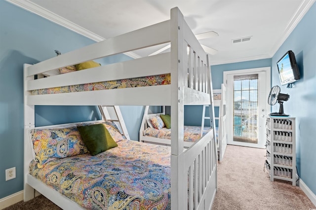 bedroom with access to exterior, crown molding, carpet floors, and ceiling fan