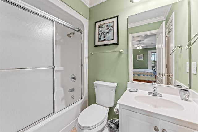 full bathroom featuring enclosed tub / shower combo, ornamental molding, vanity, and toilet