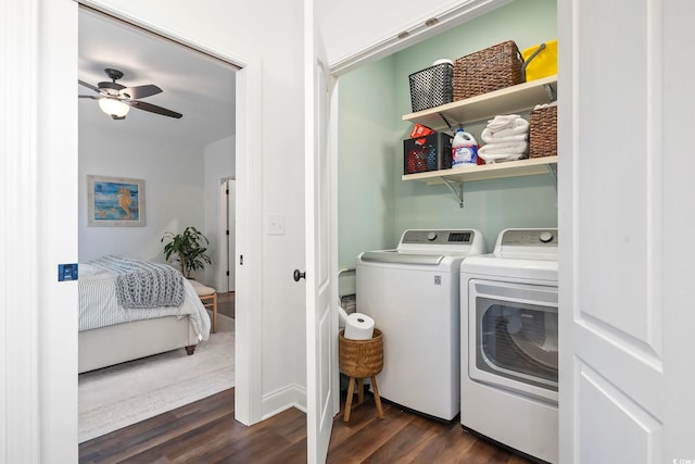 washroom featuring dark hardwood / wood-style flooring, washing machine and dryer, and ceiling fan