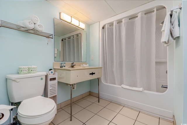 bathroom featuring tile patterned flooring, shower / bath combo, and toilet